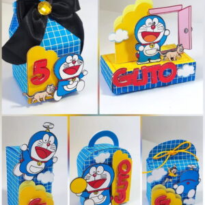 Arquivo de Corte Festa Doraemon em Studio e PDF 20 Arte digital de caixas temáticas com personagem de gato azul e detalhes coloridos.