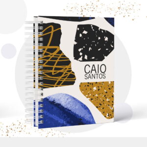 Caderno de espiral com capa de design abstrato em preto, dourado e azul.