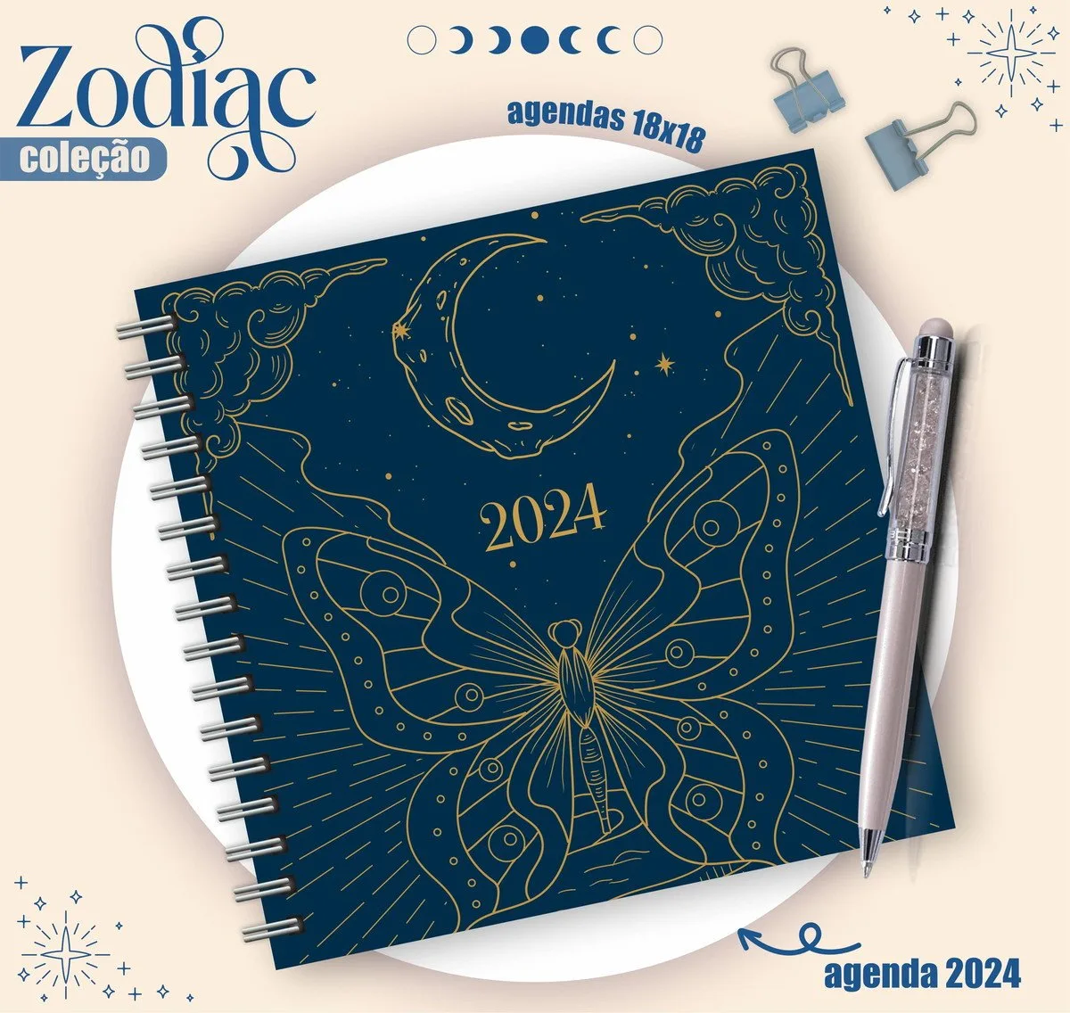Agenda azul escuro com desenho dourado de lua, borboleta e o ano 2024.