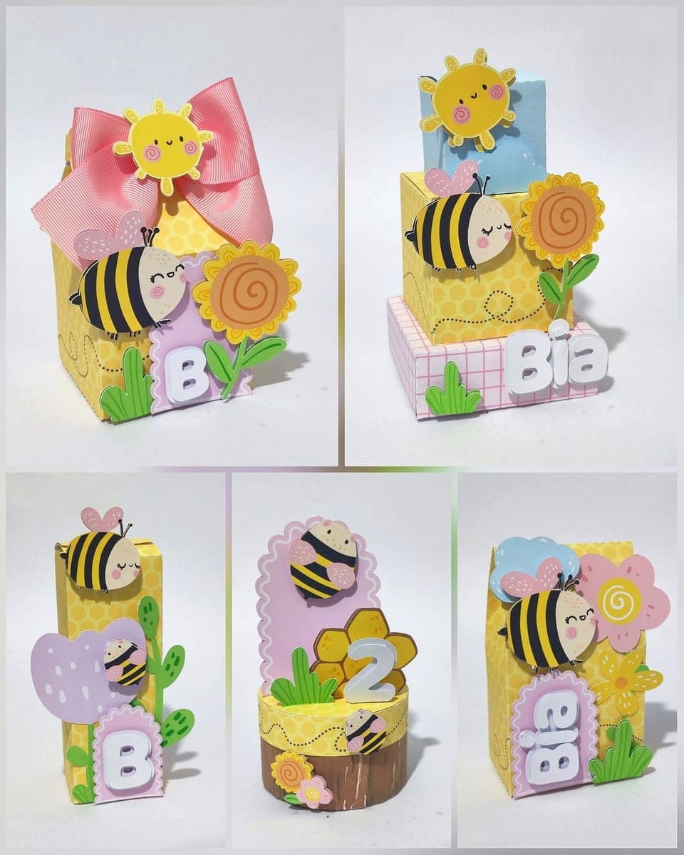 Festa Abelhinha Kit Completo em Studio e PDF 1 Conjunto de caixinhas personalizadas com tema de abelhas e flores em papelaria.