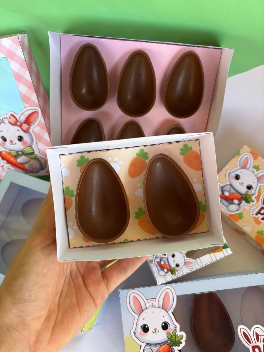 Kit Caixas Páscoa Canva para Corte em Plotter 2 Ovos de chocolate em embalagens com arte digital de coelhos e cenouras para Páscoa.