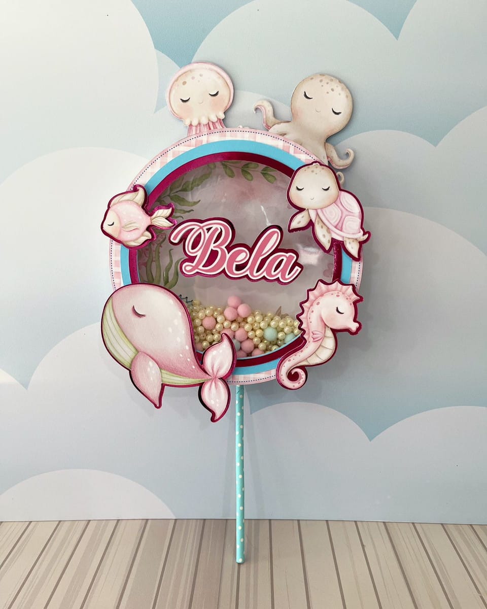 Kit Festa Fundo do Mar Rosa em Studio e PDF 3 Arte digital de decoração circular com tema marinho, animais fofos em tons de rosa e azul.